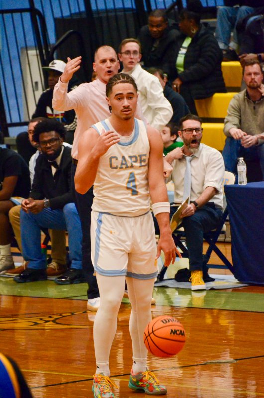 Like coach, like player as Cape coach Steve Re and junior Jameson Tingle make the same shape and motion with their hands.