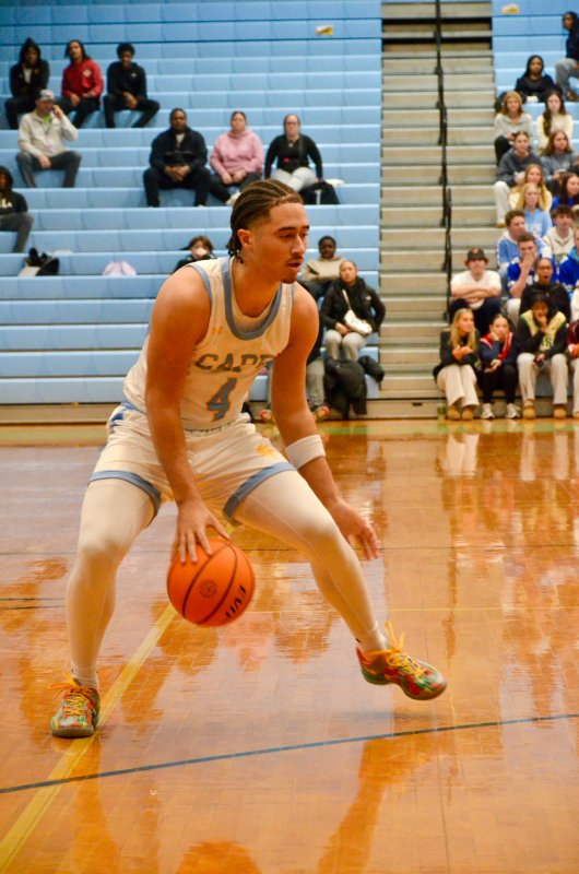 Vikings junior Jameson Tingle hits the crossover at the arc.