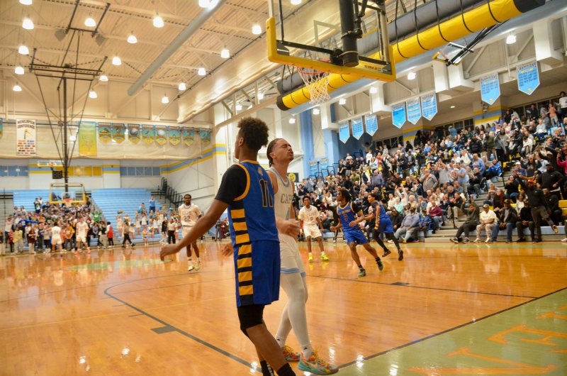 Vikings junior Jameson Tingle heads back on defense after finishing a fast break off with a dunk.