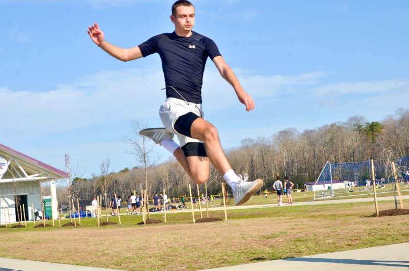 Seahawks senior Austin Taylor flies into the sand pit.