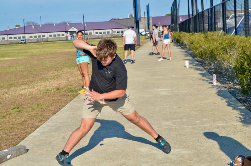 Sussex Academy sophomore Gamble Bryan begins his rotation on the shot put.