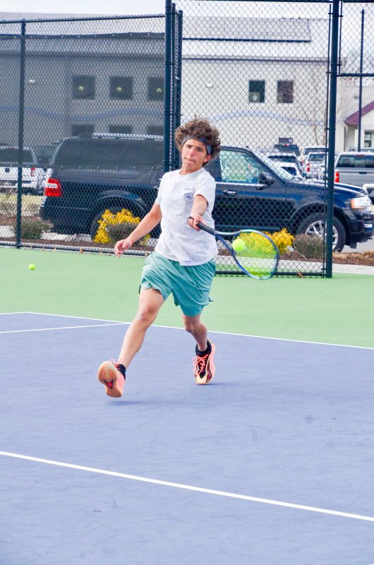 Seahawks senior Logan Mattie might have the best tennis hair in the state with the headband on.