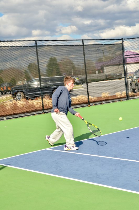 Sussex Academy junior J.P. Eichten reaches down for a ball.
