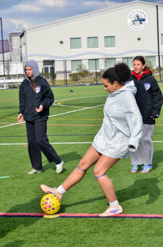 Seahawks junior Maya Hastings stops the ball at the cone.