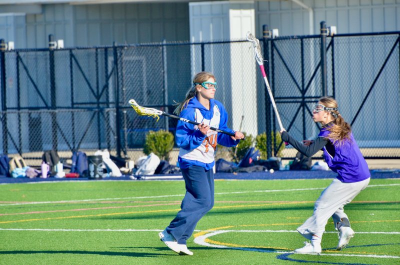 Sussex Academy junior Liz Layton looks for cutters as sophomore Logan Stiles pops out to cover her.
