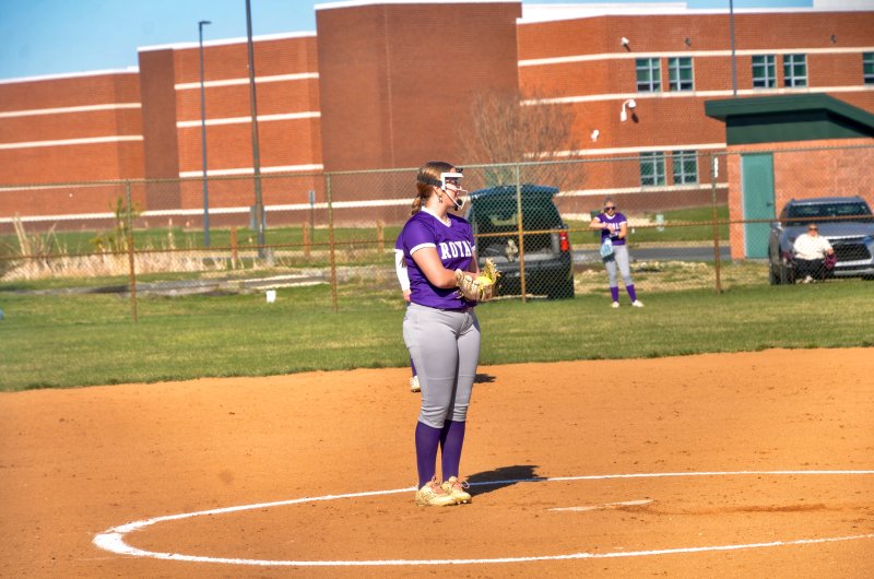 Delmarva Christian freshman Olivia Balback smiles before throwing the first pitch of the season for the Royals.