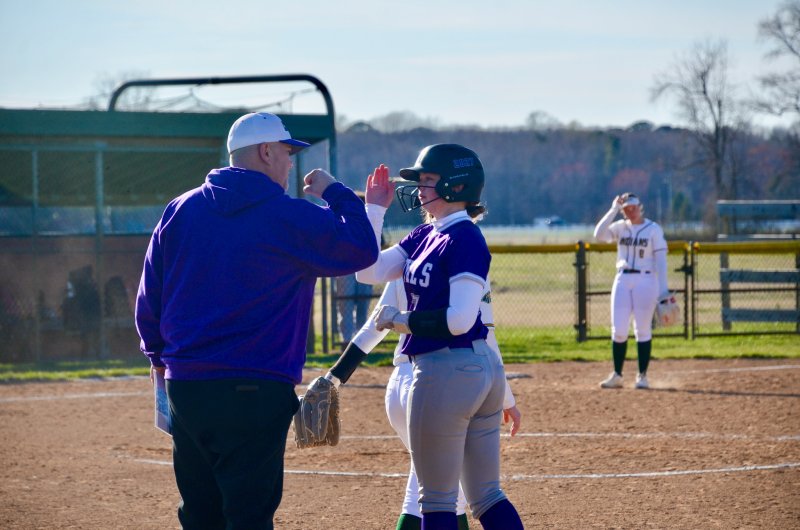Delmarva Christian junior Kaelyn McGuinness gets props following her single in the top of the fifth inning during the Royals’ 14-4 loss to IR March 24. AARON R. MUSHRUSH PHOTOS