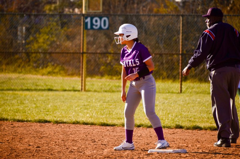 Delmarva Christian freshman Violet Ryan looks over for signals from her third-base coach.