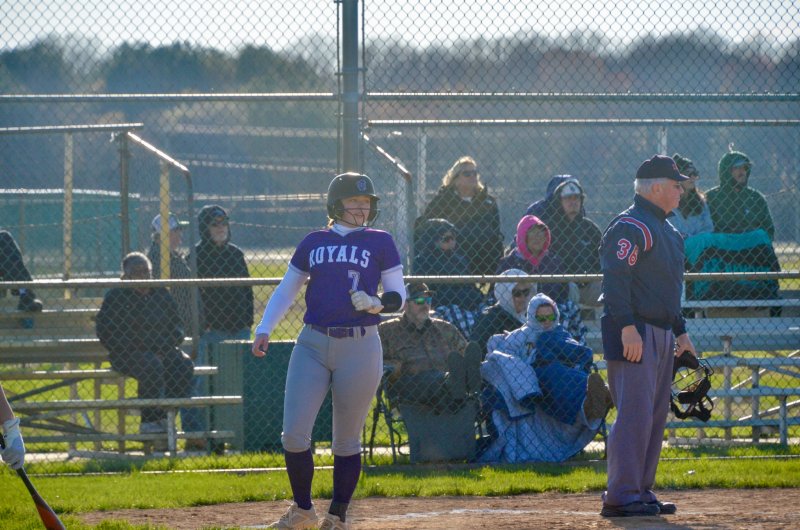 Royals junior Kaelyn McGuinness looks at the action in the field after scoring a run.