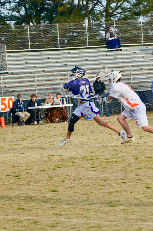 Seahawks junior Gideon Sammons shoots on the run with a defender in his chest.