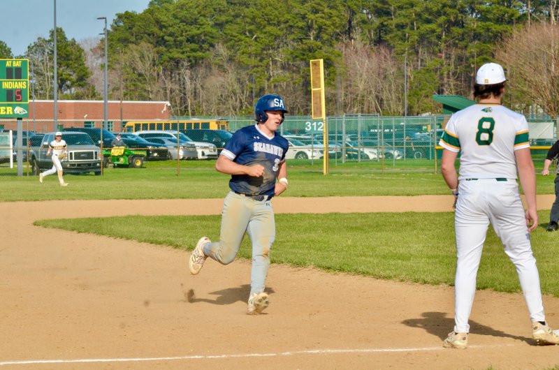Sussex Academy sophomore Mason Glover trots into third base.
