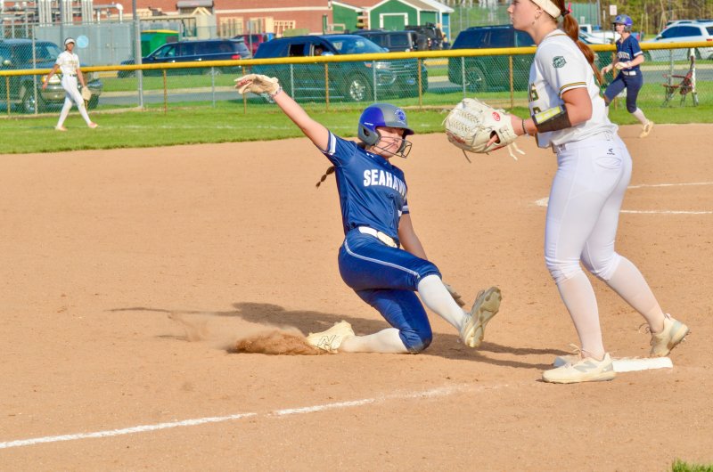 Sussex Academy sophomore Teagan Forester slides into third base.