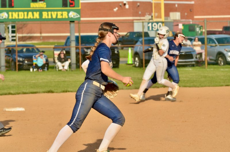 Sussex Academy freshman Danica Bergh trots in after snagging an out.