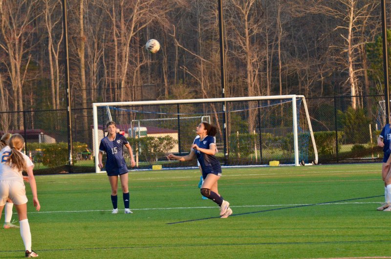 Sussex Academy junior Maya Hastings braces for a header.