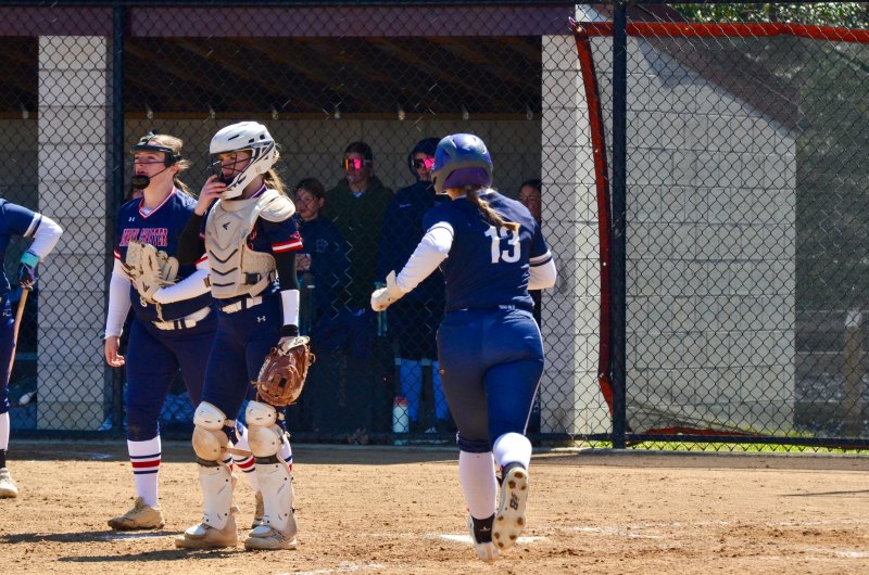 Sussex Academy junior Grayce Glover trots into home March 28 against Newark Charter.