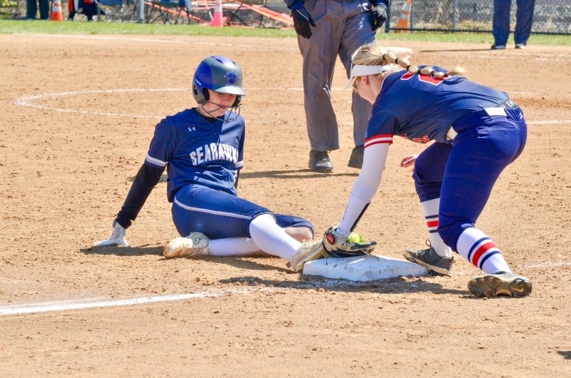 Sussex Academy junior Caroline White just missed beating the throw, but plated some runners on her hit.