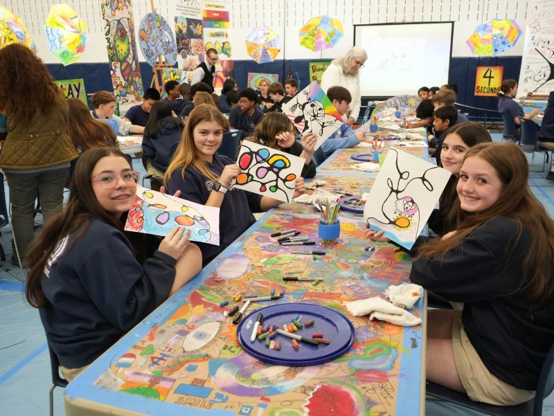 Students channel their creativity into their artwork. Sitting on the left are Bailey LeCates and Meredith Sachs. On the right are Hattie Thompson and Jillian Warren.