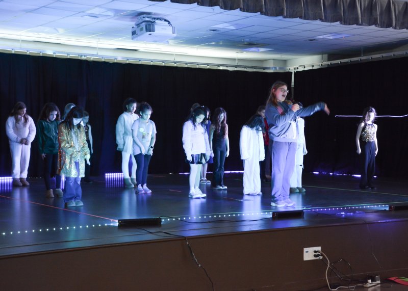 Rehoboth Elementary fourth-grader Madison Bennett leads a group of students in the grand finale performance of “Golden.” SUBMITTED PHOTOS