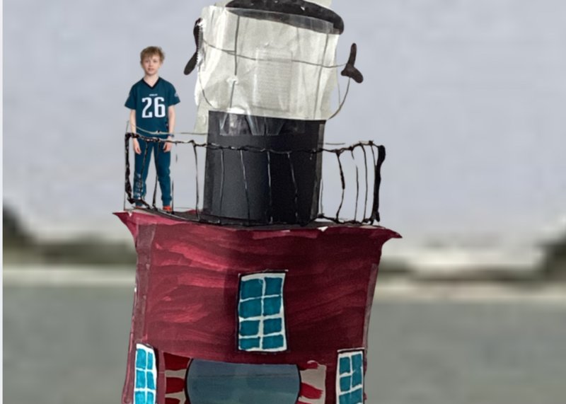 Lewes Elementary School student Peter Hastings used green-screen technology to put himself at the top of his Delaware Breakwater East End Light model and provide viewers with information on the structure’s history. SUBMITTED PHOTOS