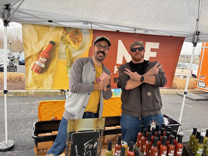 Among the local small vendors on hand are Tim Auman, left, and Mike Frank of MF Heat Co., who provided samples of their homemade hot sauces.