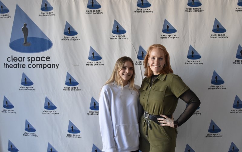 Student Addison Wood and Marketing Manager Gabrielle Glanville work to advertise for Clear Space Theatre Company.