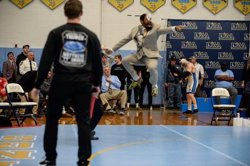 Coach Bijan Banks of William Penn goes airborne.