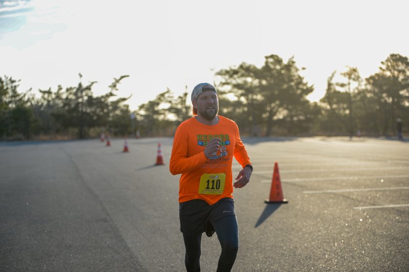 Tim Pagano wins the 5K in 17:28.