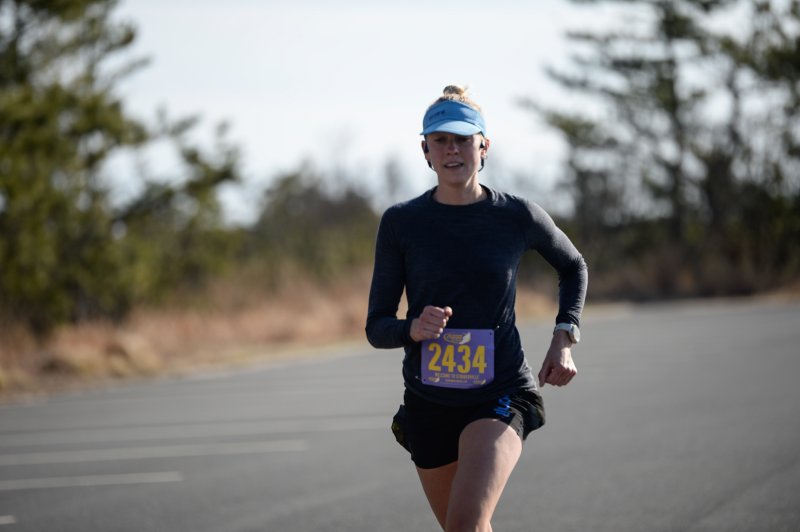 Elizabeth Haugar wins the women’s half-marathon in 1:28:56.