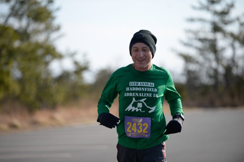 Paul Montini wins the masters title for the half-marathon in 1:28:56.