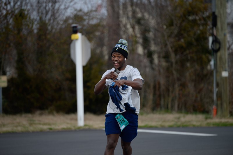 Leo Hunsberger is all smiles en route to a time of 35:51.