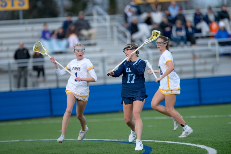 Regan Best scores a goal as Delaney Miklus moved in to defend. DAVE FREDERICK PHOTOS
