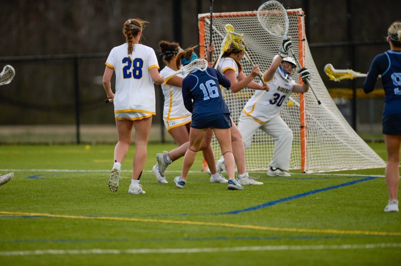 Makenzie Todd shoots and scores past goalie Mei-Li Fite.