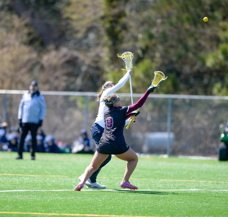 Ally Diehl battles Harper Frye on the opening face-off. DAVE FREDERICK PHOTOS