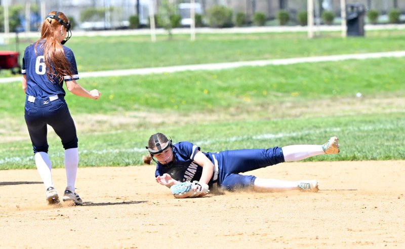 Sussex Academy freshman Danica Bergh makes a diving play at short.