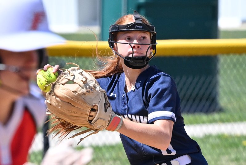 Sussex Academy freshman third baseman Emma Orlen throws out a runner from the hot corner.