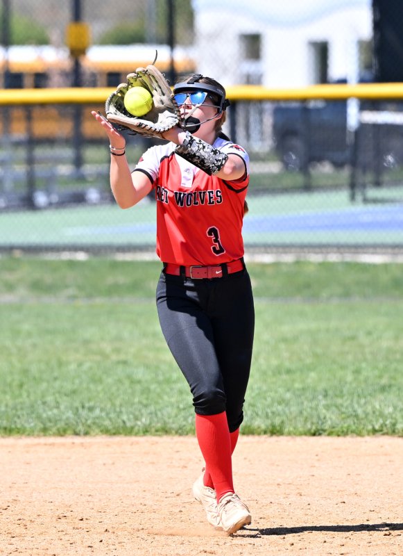 Conrad sophomore shortstop Madison Moser squeezes a ball for an out.