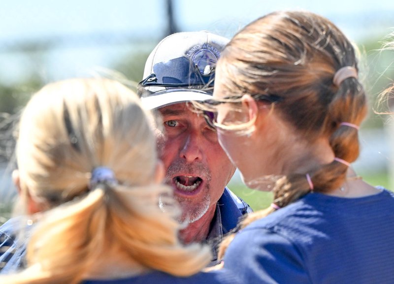 Seahawks coach Gerald Jester gets his team fired up for the sixth inning.
