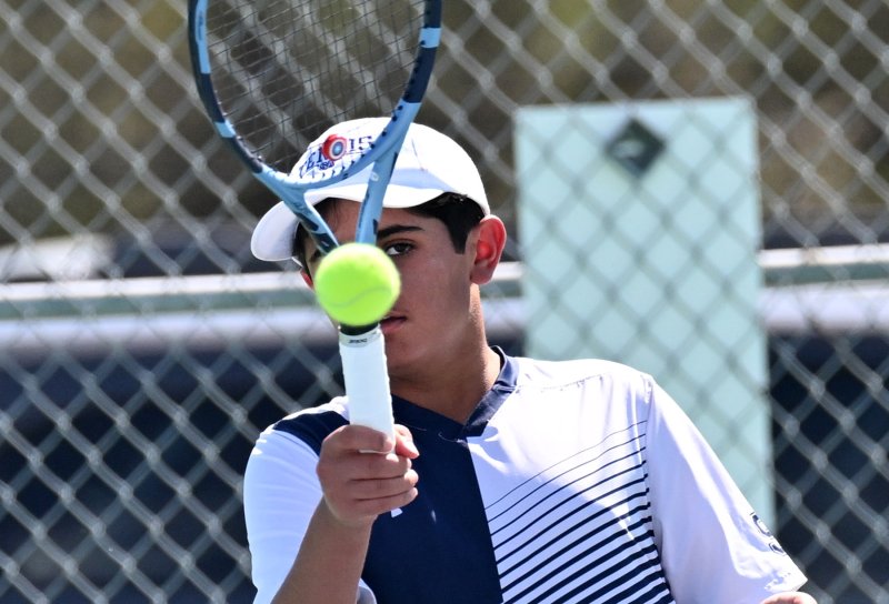 Sussex Academy’s Arjun Verma keeps his eye on the ball at first doubles.