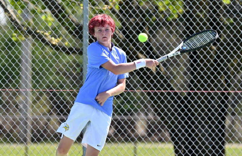 Cape’s Ace Crandell slams a forehand at second doubles.