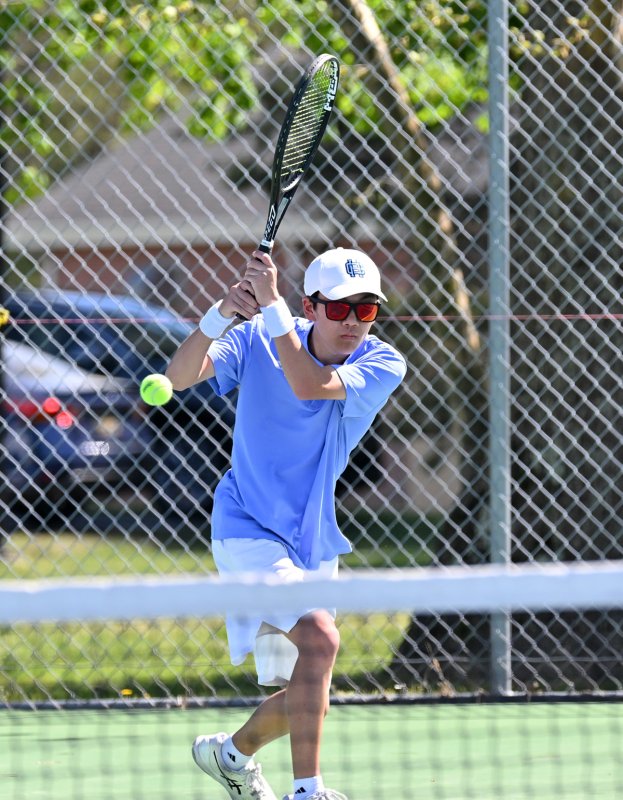 Nathan Hoang hits a backhand drive at first singles.
