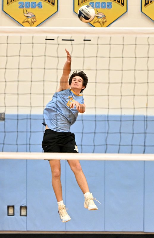 Jason Harpel-Rickards serves an ace to the Wolves.
