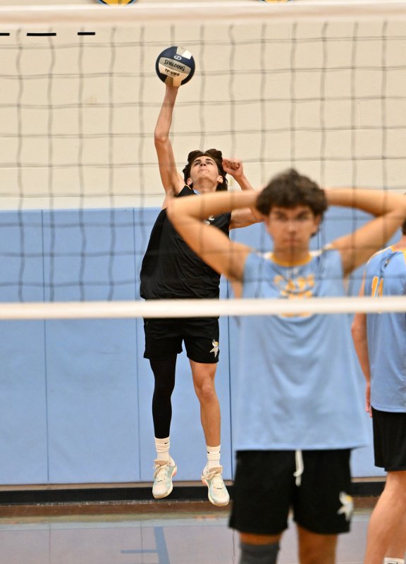 Cape libero Jake Panyko serves an ace.
