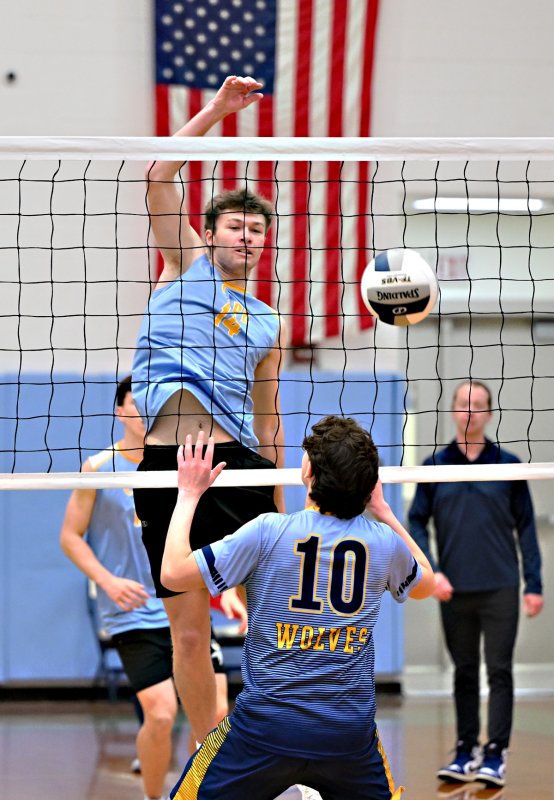 Cape senior Lawson Whaley pounds one of his 10 kills in the 3-0 win.