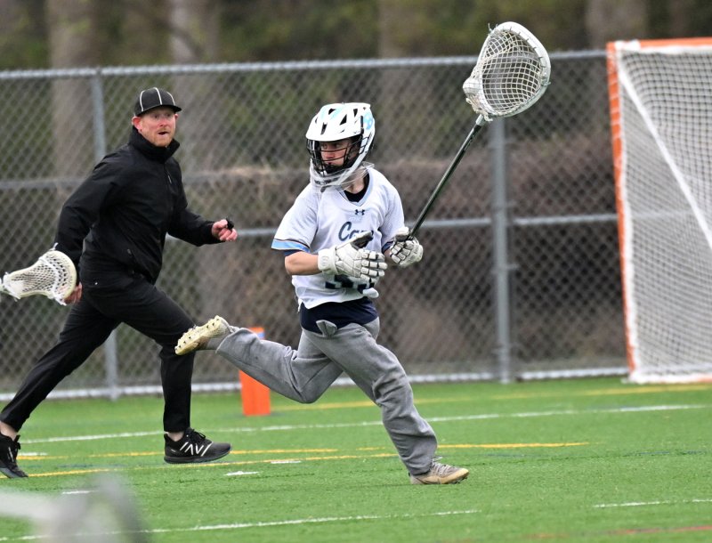 Cape goalie Mason Trench makes a clear after a save.