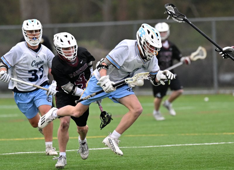 Cape’s Marshall Keys goes airborne to avoid the trip by a Radnor’s Eli Dougherty.