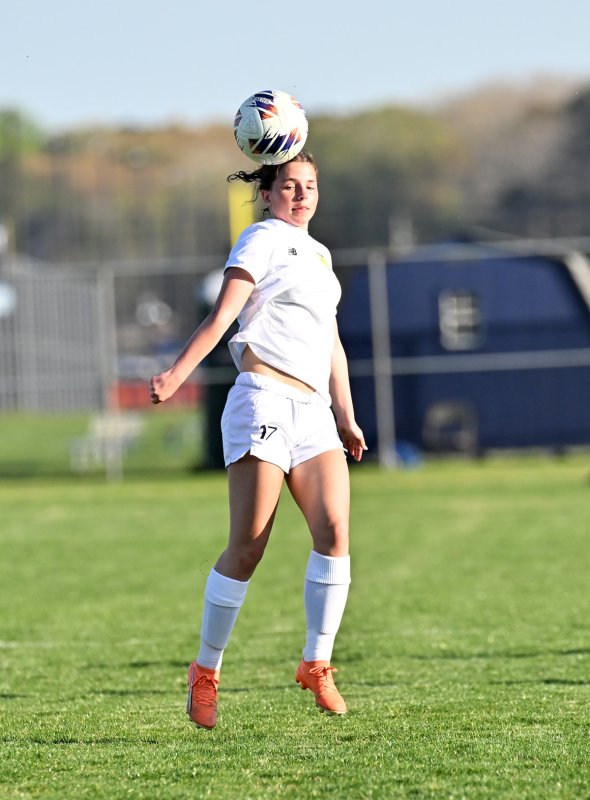 Cape freshman Lily Touw heads a clear in the midfield.