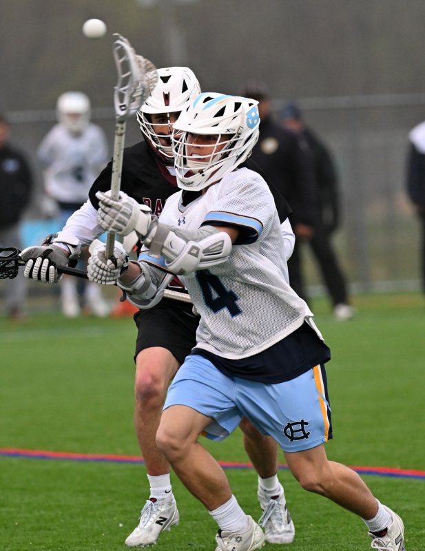 Cape sophomore Alan Grapski passes to the Radnor crease.
