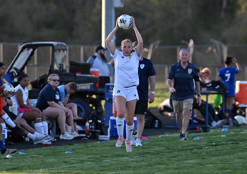 Cape sophomore Zoey Neufeld takes a throw in by the Vikings bench.