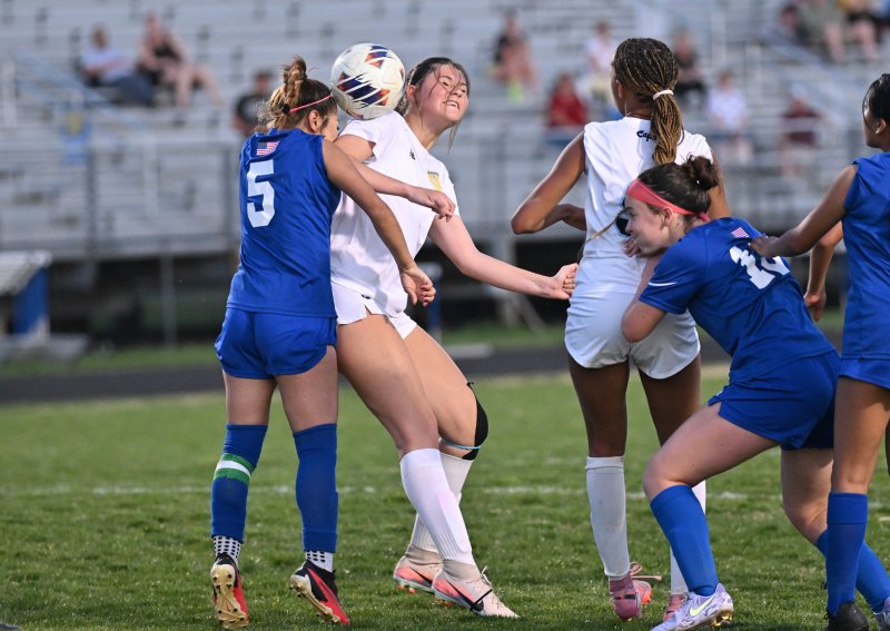 Cape’s Ashlynn Panyko battles for a header with Central’s Belinda Roblero Perez.