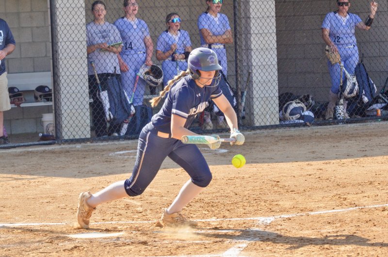 Sussex Academy senior Delainie Monitzer bursts from the batter’s box after dropping a bunt down.